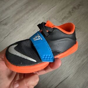 Nike Kids Black, Orange, and Blue Sneakers